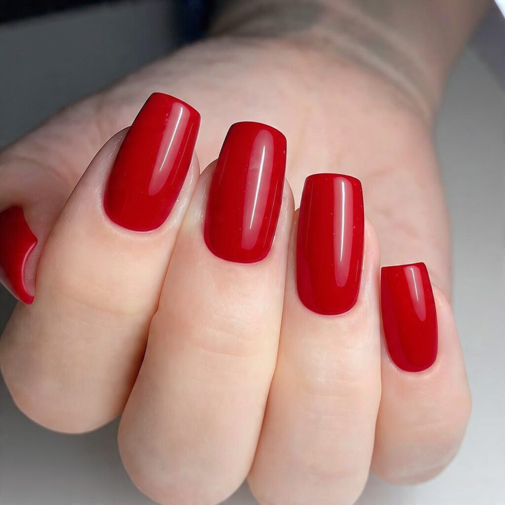 classic red christmas nails with glossy candy