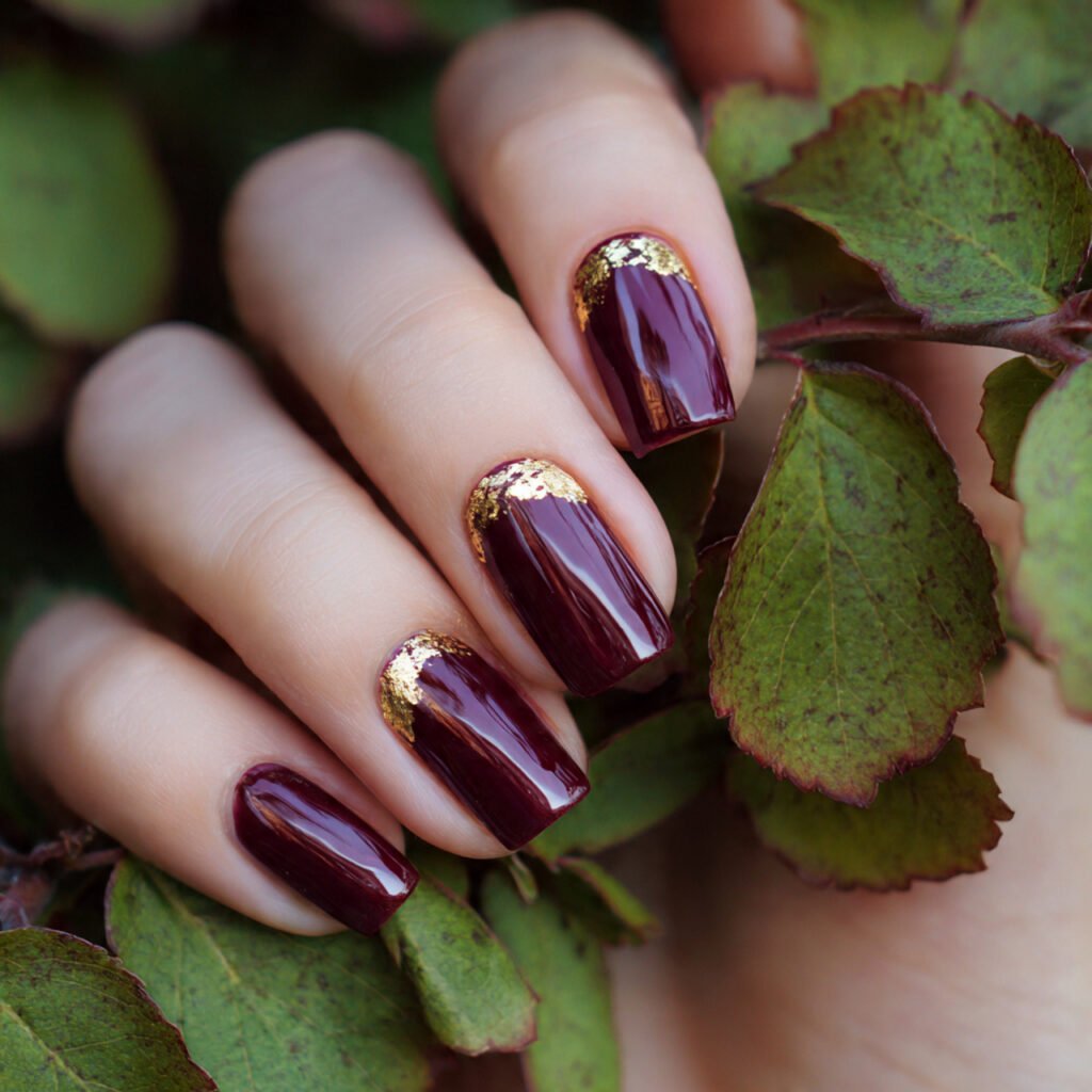 deep wine nails with a gold foil