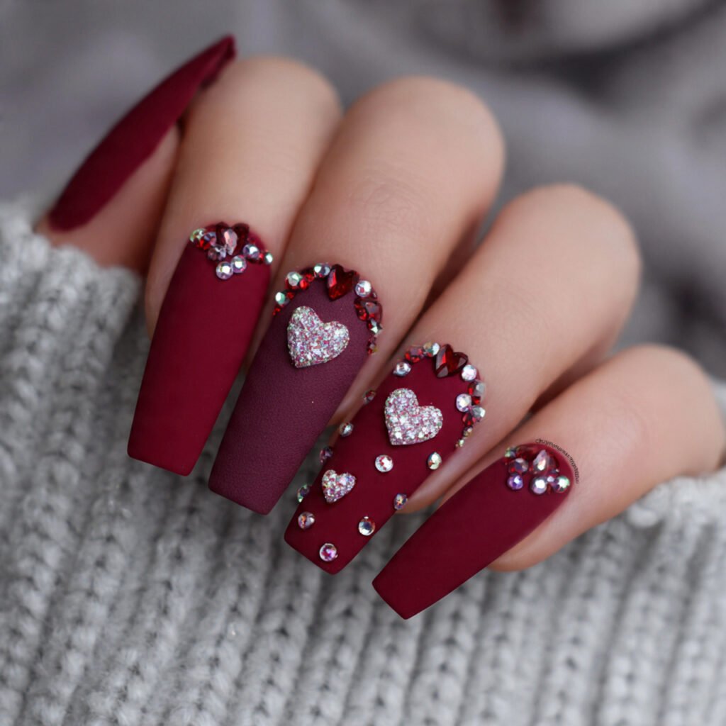 red velvet matte with heart rhinestones nails