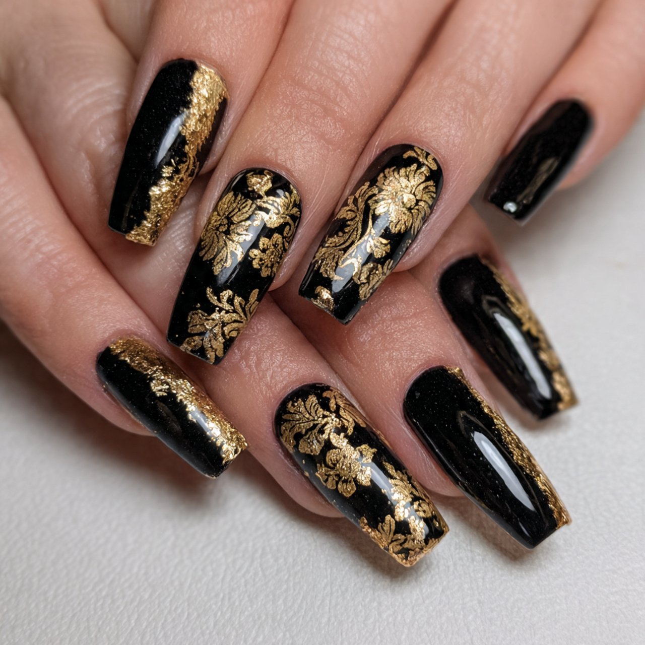 black base with gold foil accents attractive nails