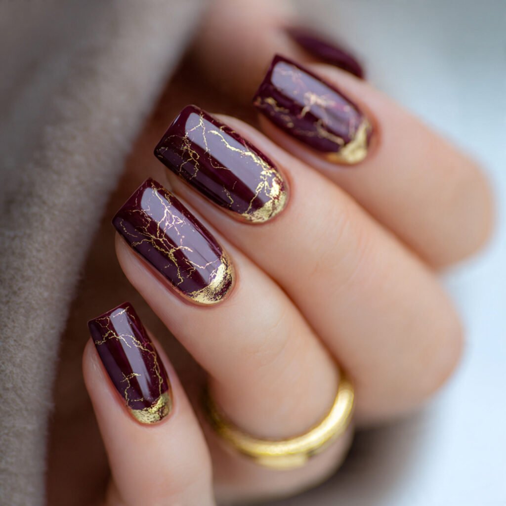 deep burgundy with gold foil attractive nails
