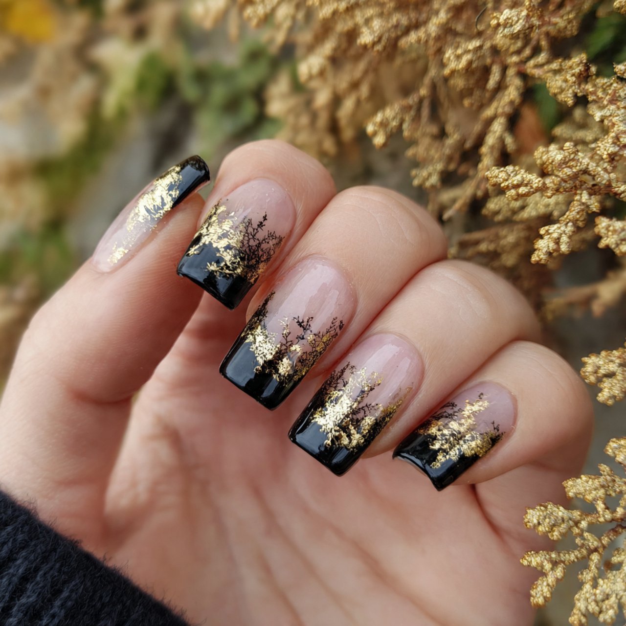 glossy black base with gold tips nature look nails