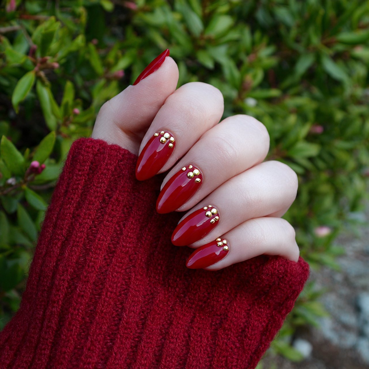 red nails with gold studs nature look nails