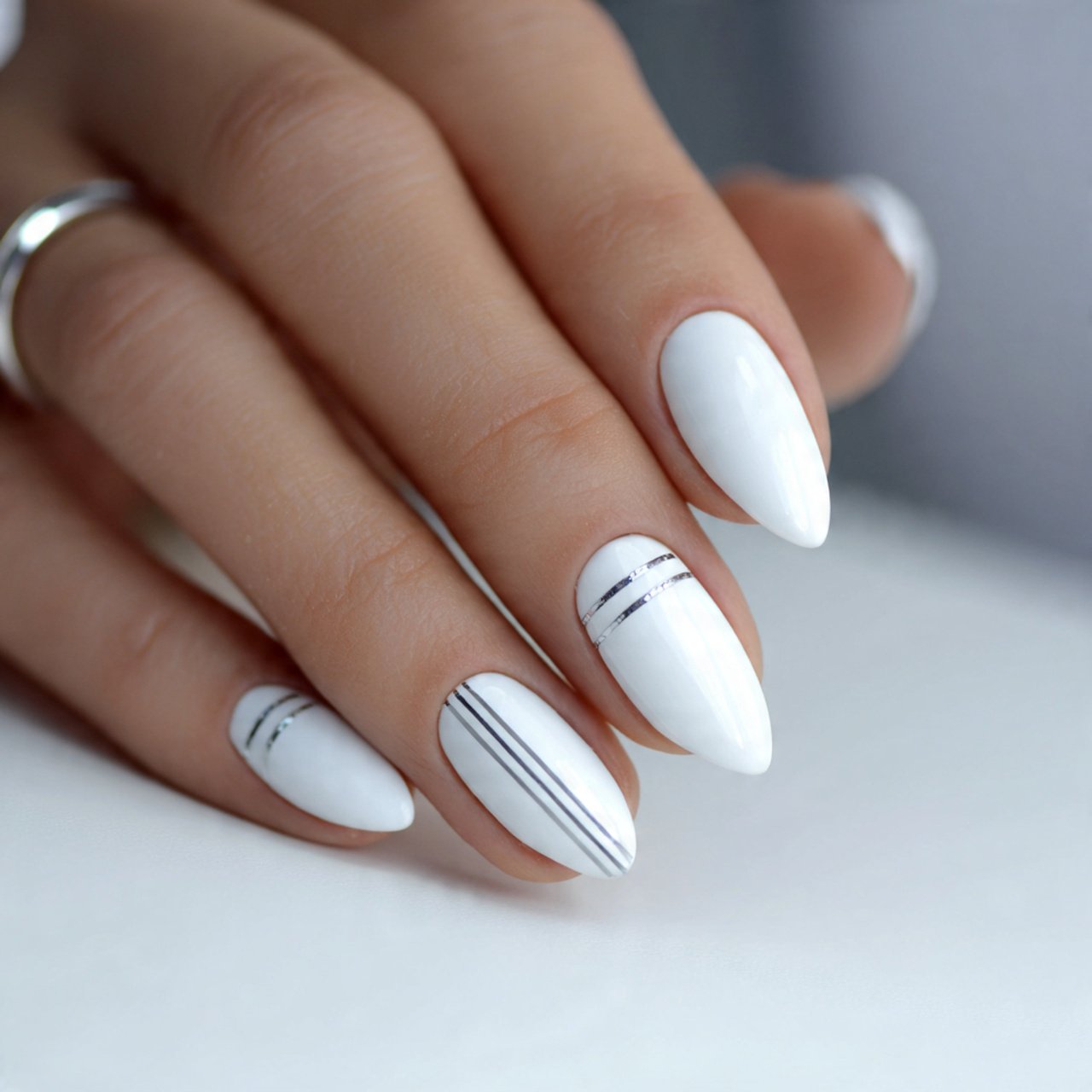 white cat eye nails with minimalist lines attracti