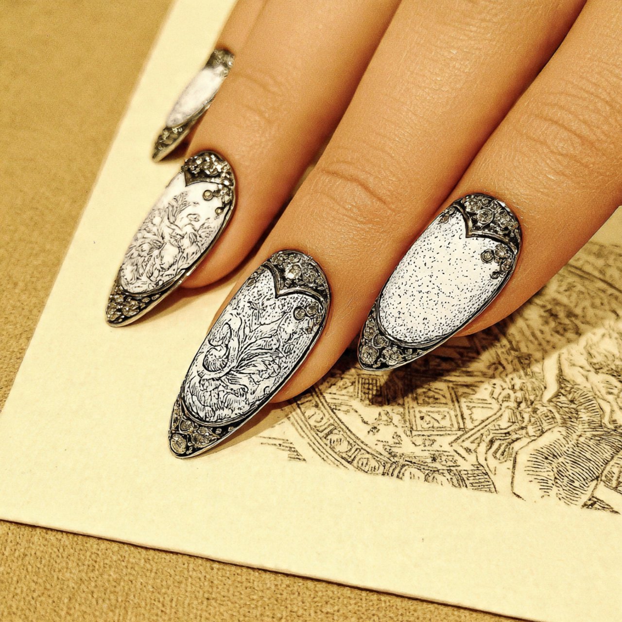 white cat eye nails with rhinestones creative nail