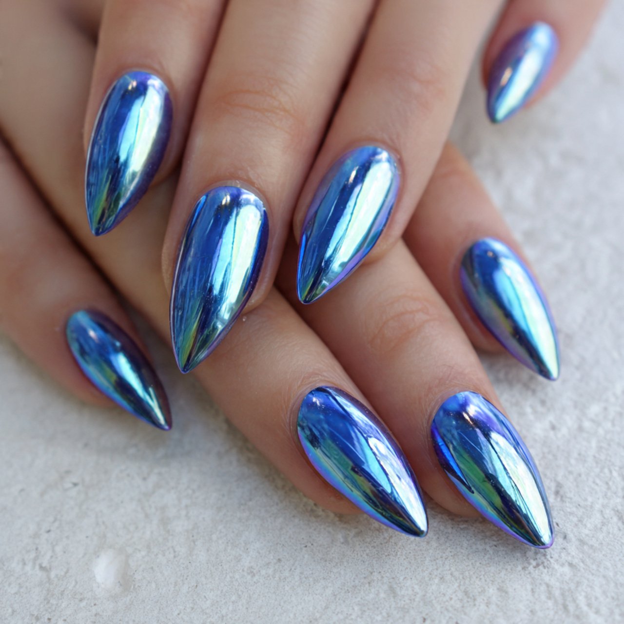 Blue Winter Nails: 15 Chic, Wearable Designs That Look Polished All Season 1 icy blue chrome almond nails attractive nails