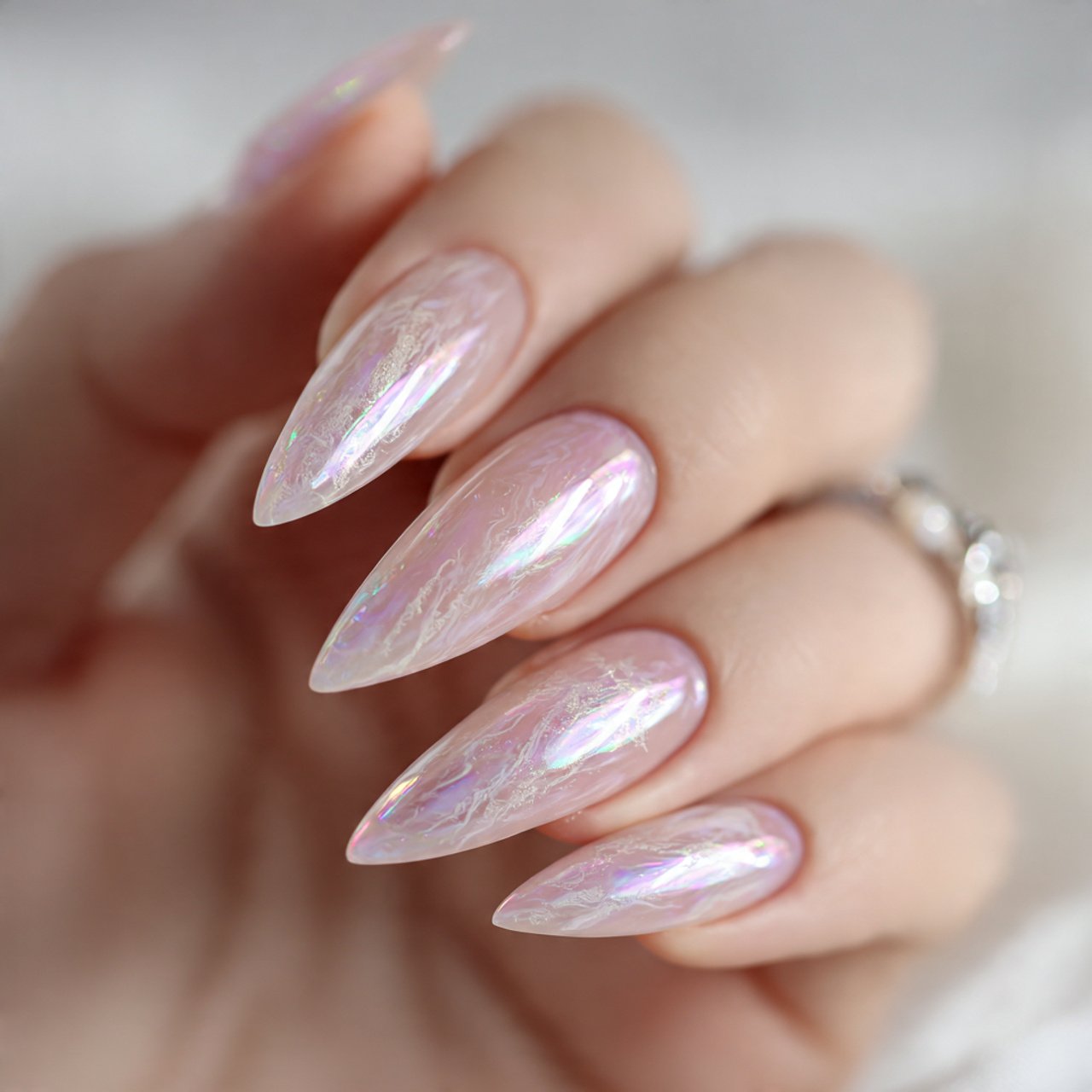 milky stiletto with glassy shine nature look nails