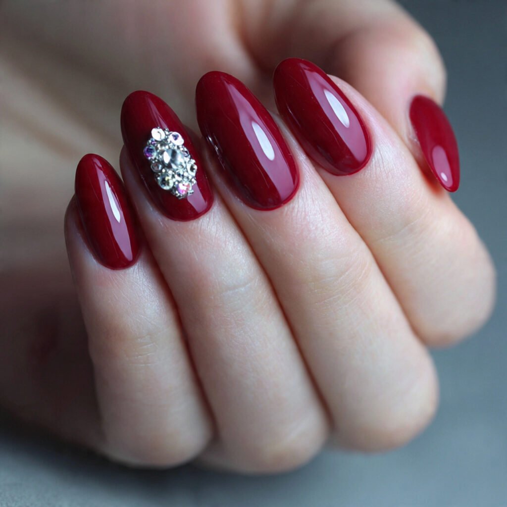 ruby red nails with one crystal accent gorgeous na