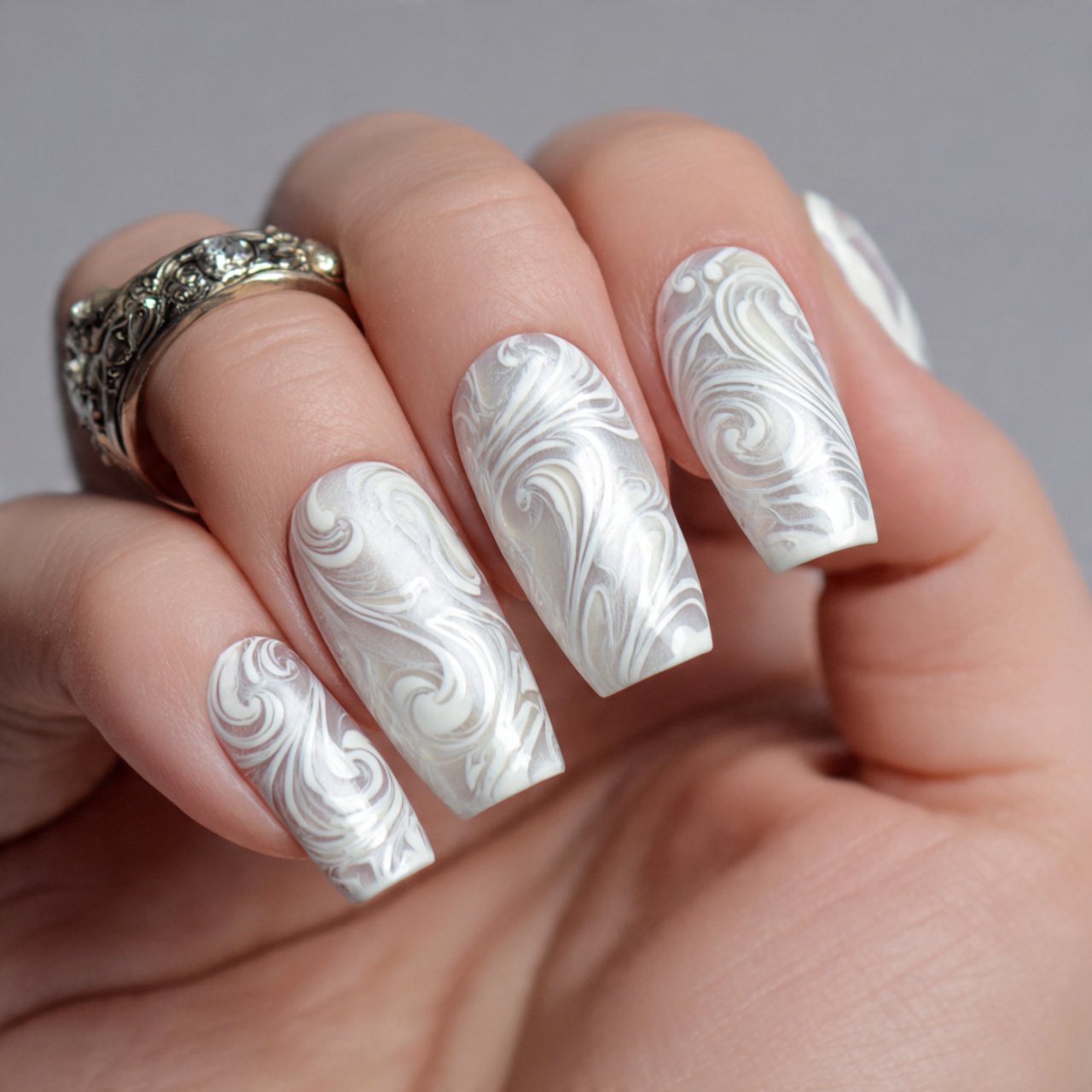 white swirl art on nude short nails