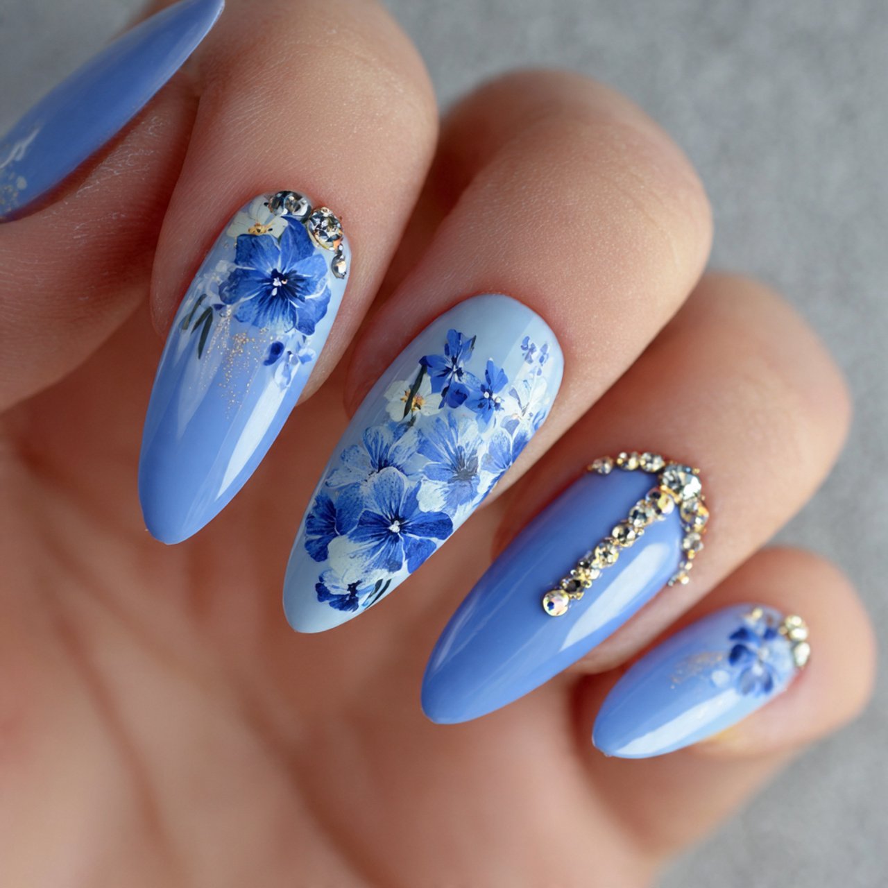 blue acrylic almond nails with floral accents nail