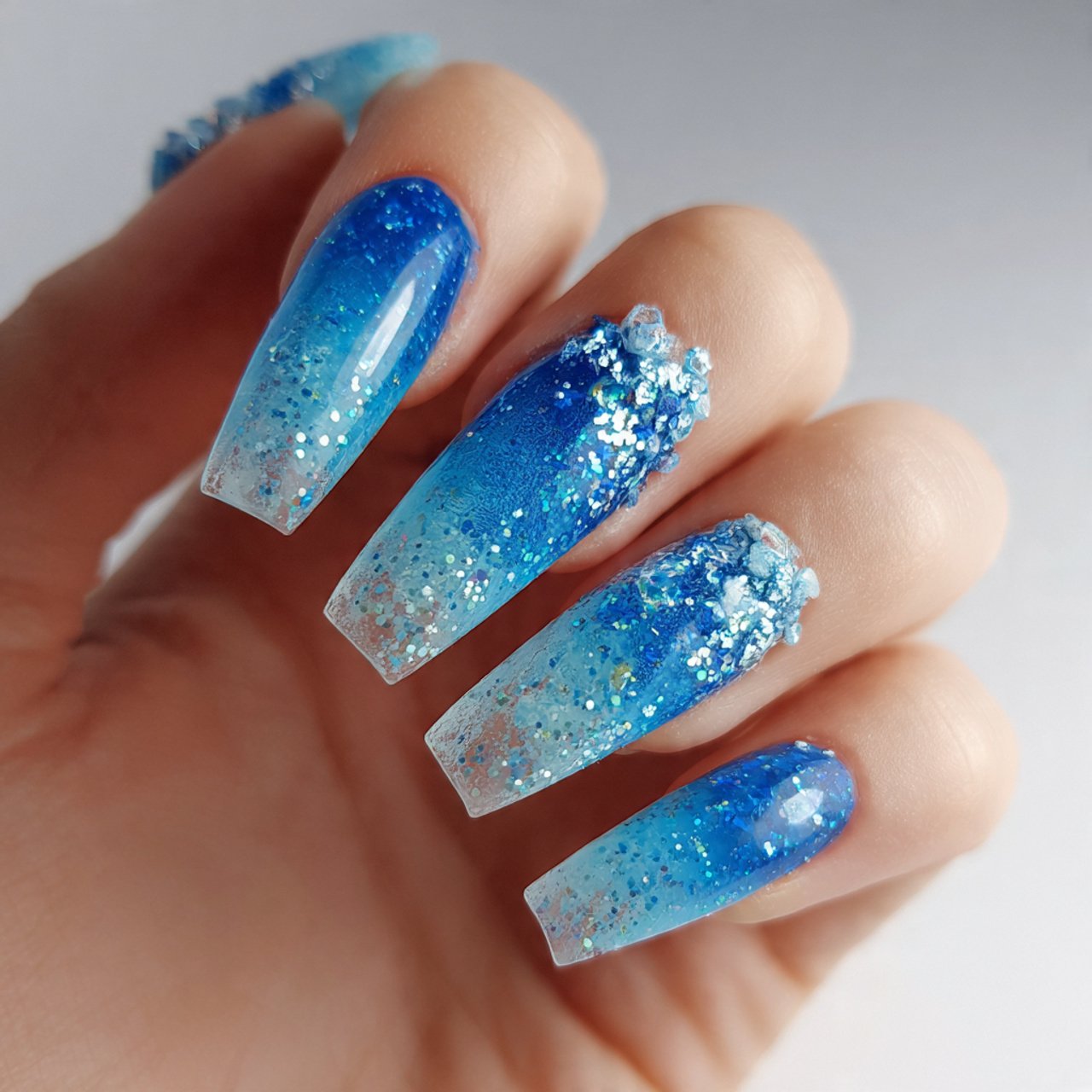 blue acrylic nails with glitter fade nails