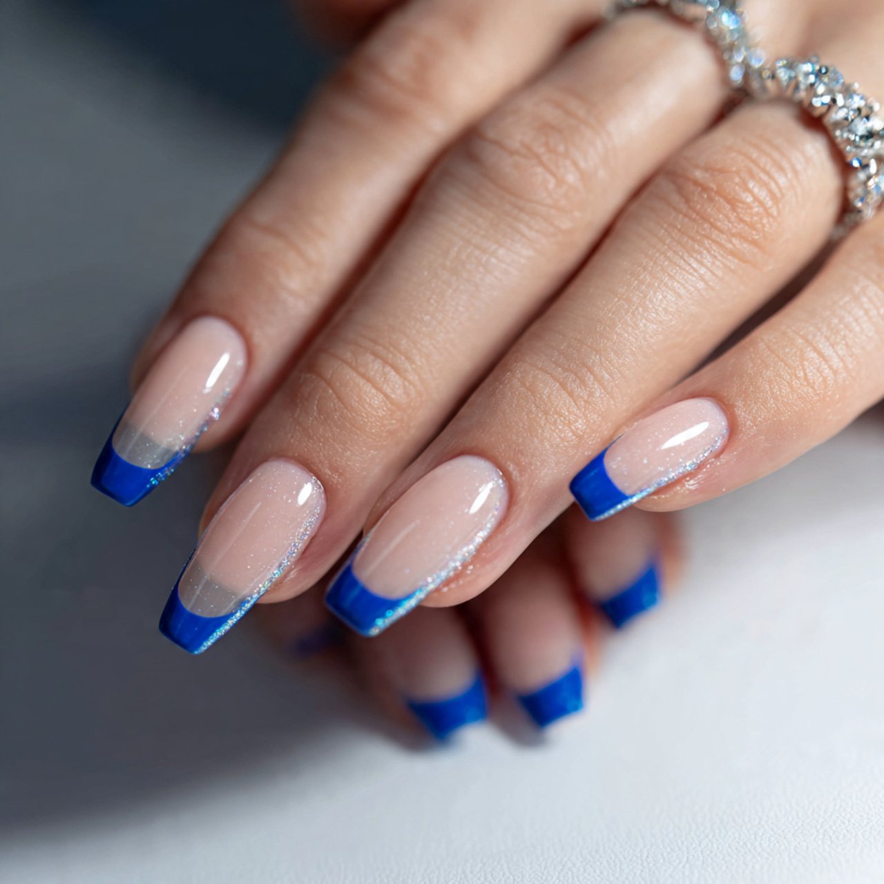 blue french tips with a sheer base nails