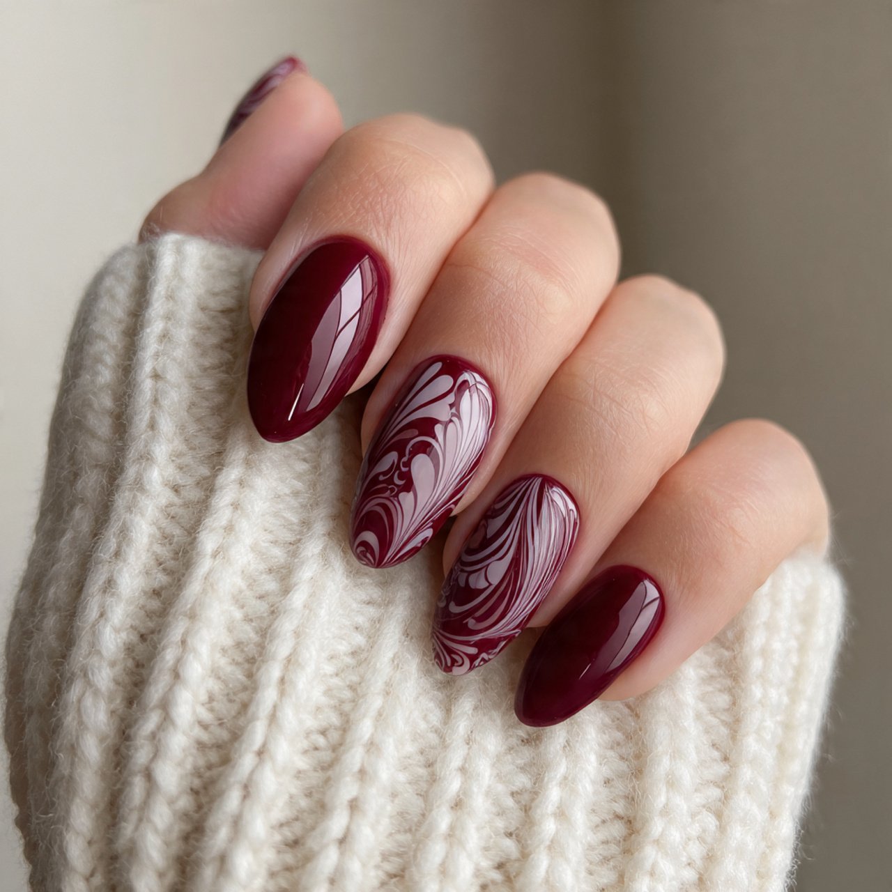 burgundy and swirl almond nails