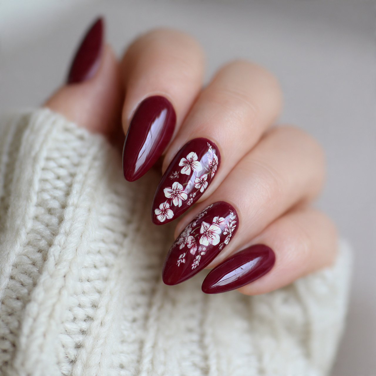 burgundy floral detail almond nails