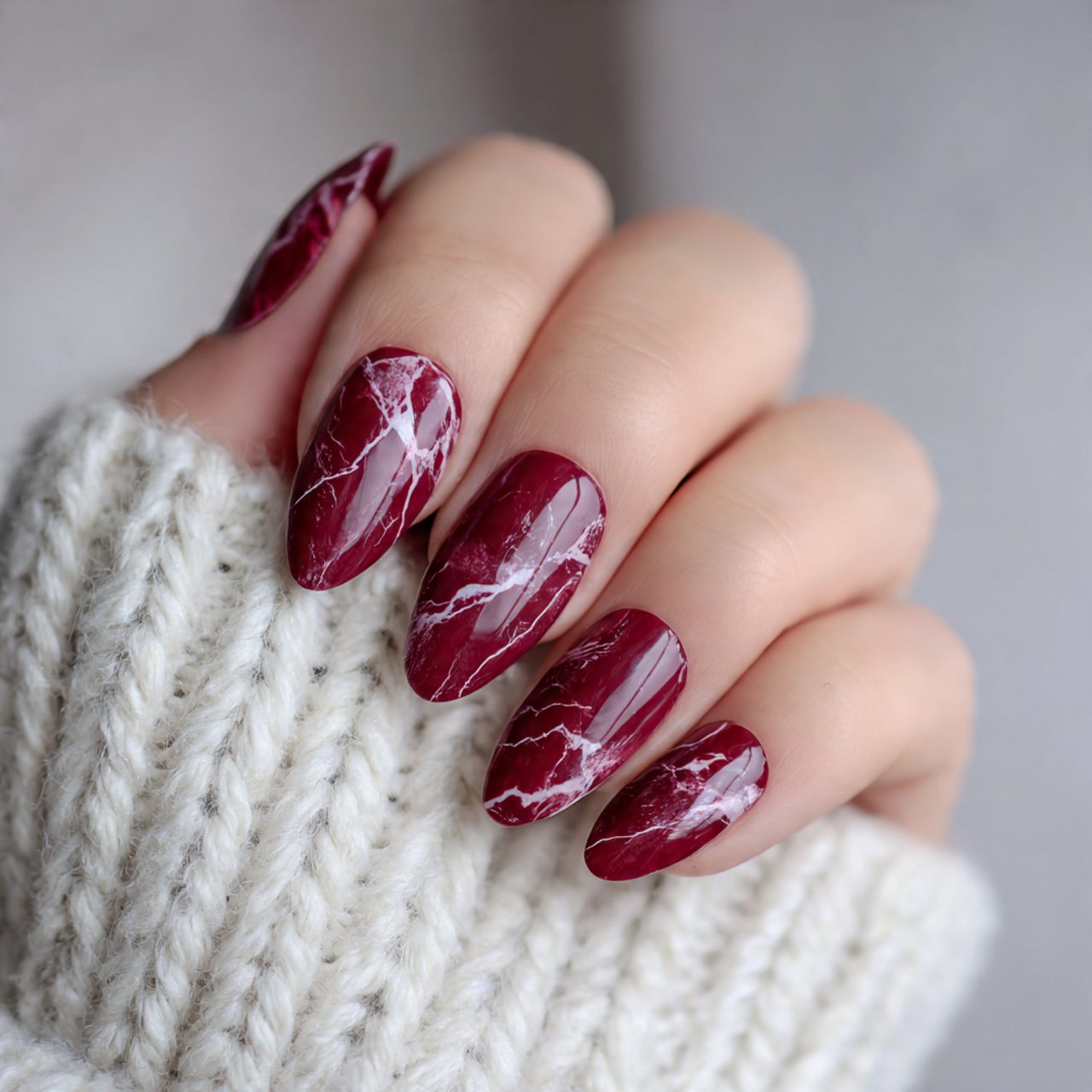 burgundy marble almond nails