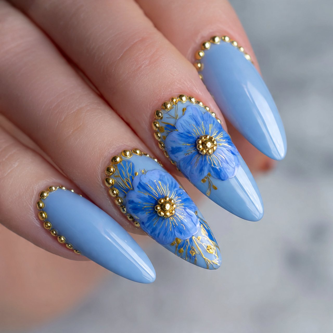 cornflower blue floral nails with gold bead center