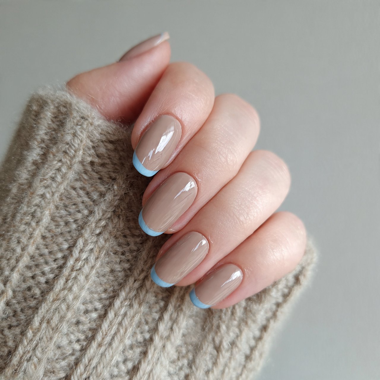 latte brown base with powder blue accent nails
