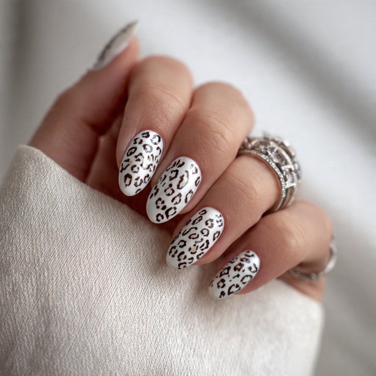 leopard nails on a milky white base nails