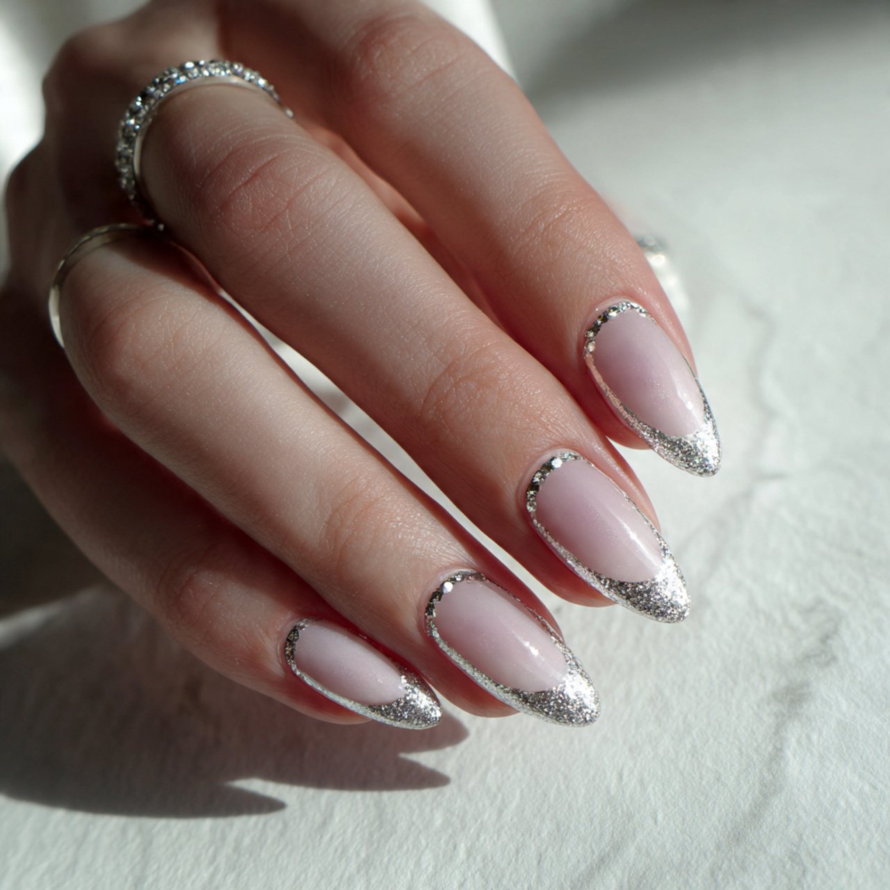 milky white nails with tiny silver accents nails