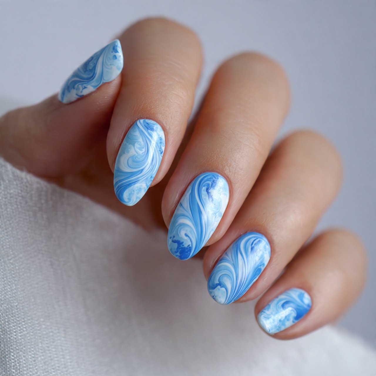 sky blue and white swirl nails