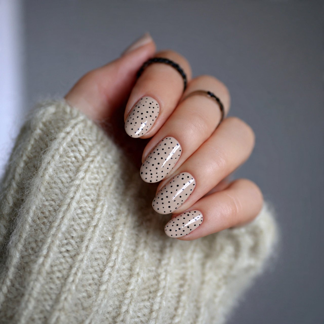 soft beige nails with black micro dots nails