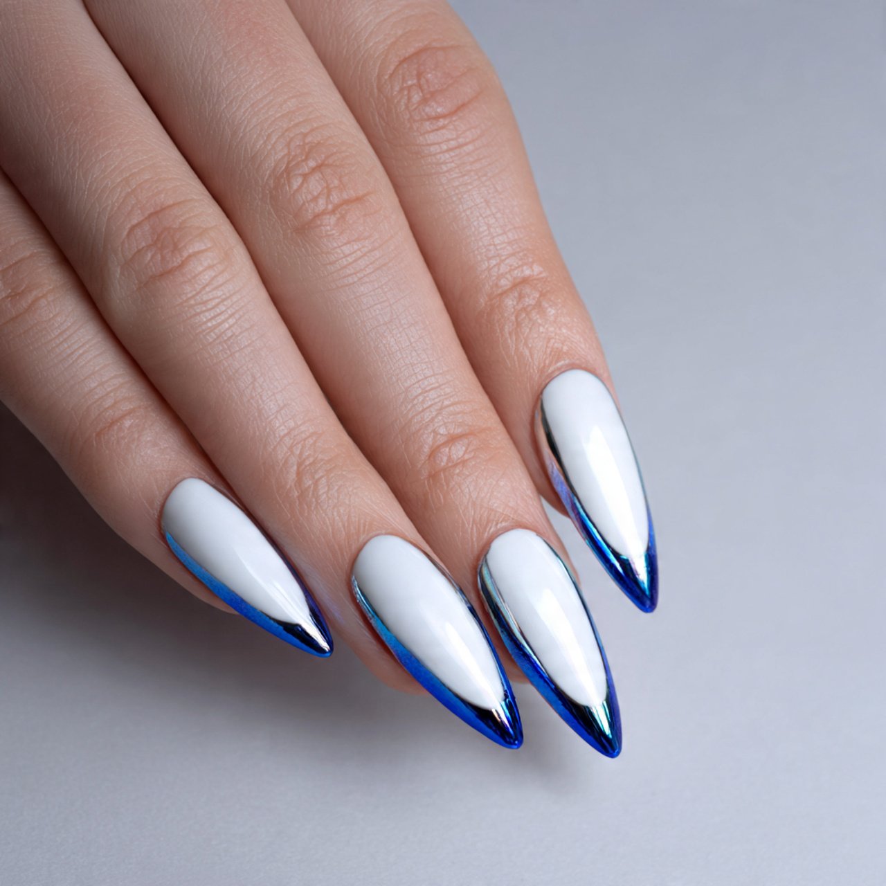 Blue and White Nails: 15 Elegant, Wearable Designs That Still Feel Fresh 9 white glazed nails with blue chrome tips nails