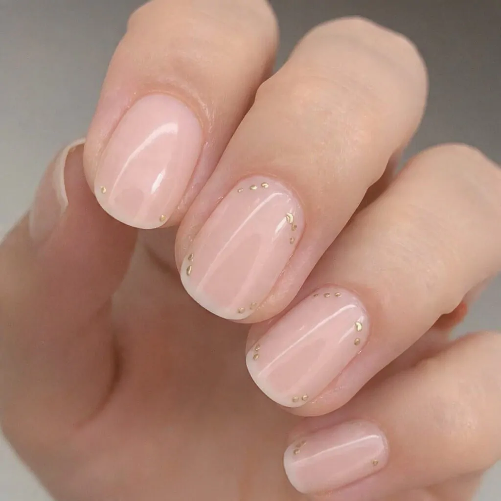 Chinese New Year Nails: 15 Lucky, Stylish Nail Designs That Look Luxe (Not Costume) 10 minimal gold lucky coin dots on natural