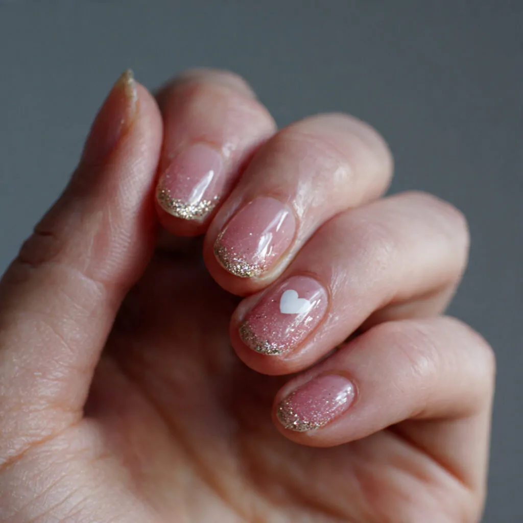 Cute Nails Ideas: 15 Salon-Tested Designs That Look Adorable, Clean, and Easy to Wear 2 nude base tiny heart accent sweet