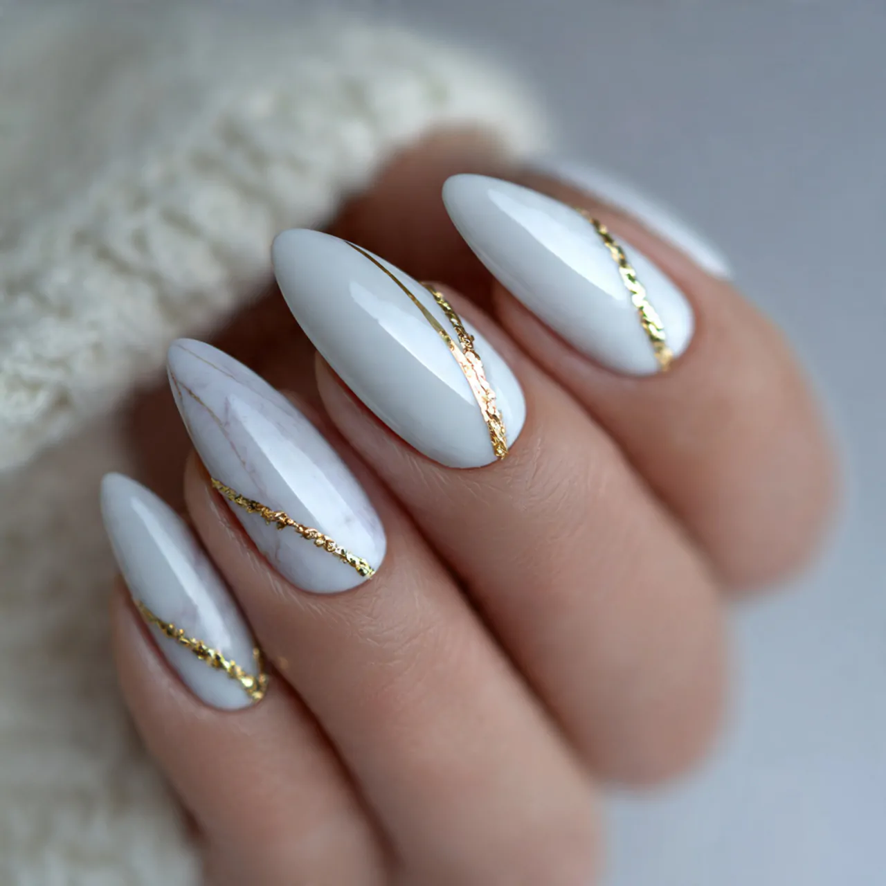 White Cat Eye Nails: A Sleek and Sophisticated Nail Trend 2 white cat eye nails with gold detailing attractive