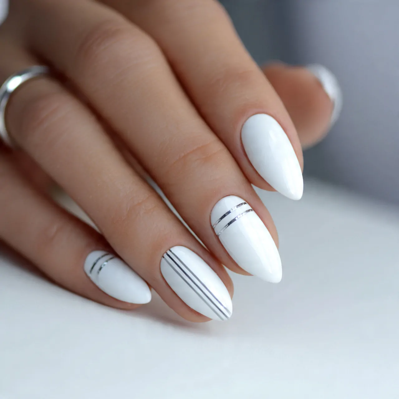 White Cat Eye Nails: A Sleek and Sophisticated Nail Trend 11 white cat eye nails with minimalist lines attracti
