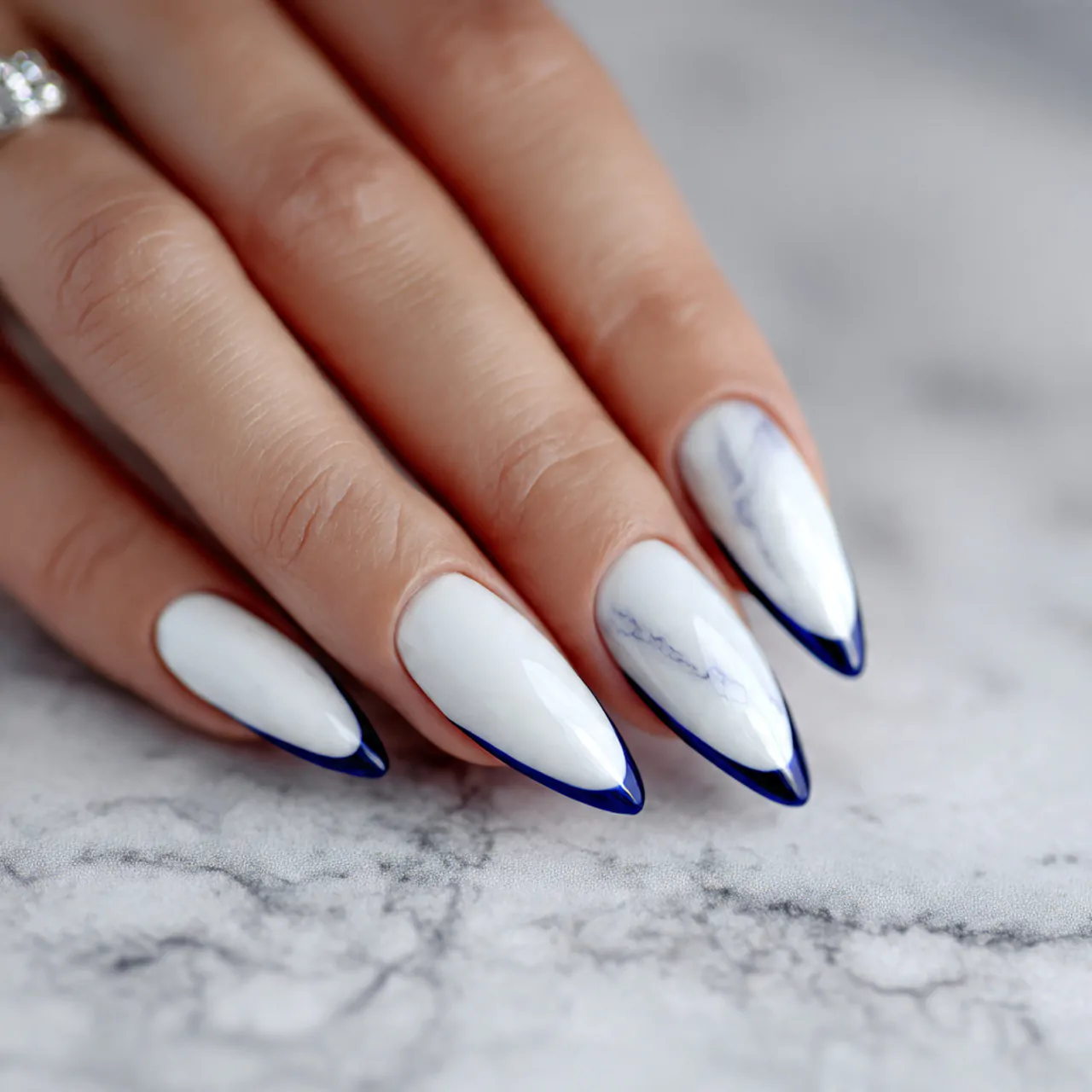 White Cat Eye Nails: A Sleek and Sophisticated Nail Trend 13 white cat eye nails with navy blue accent nature n