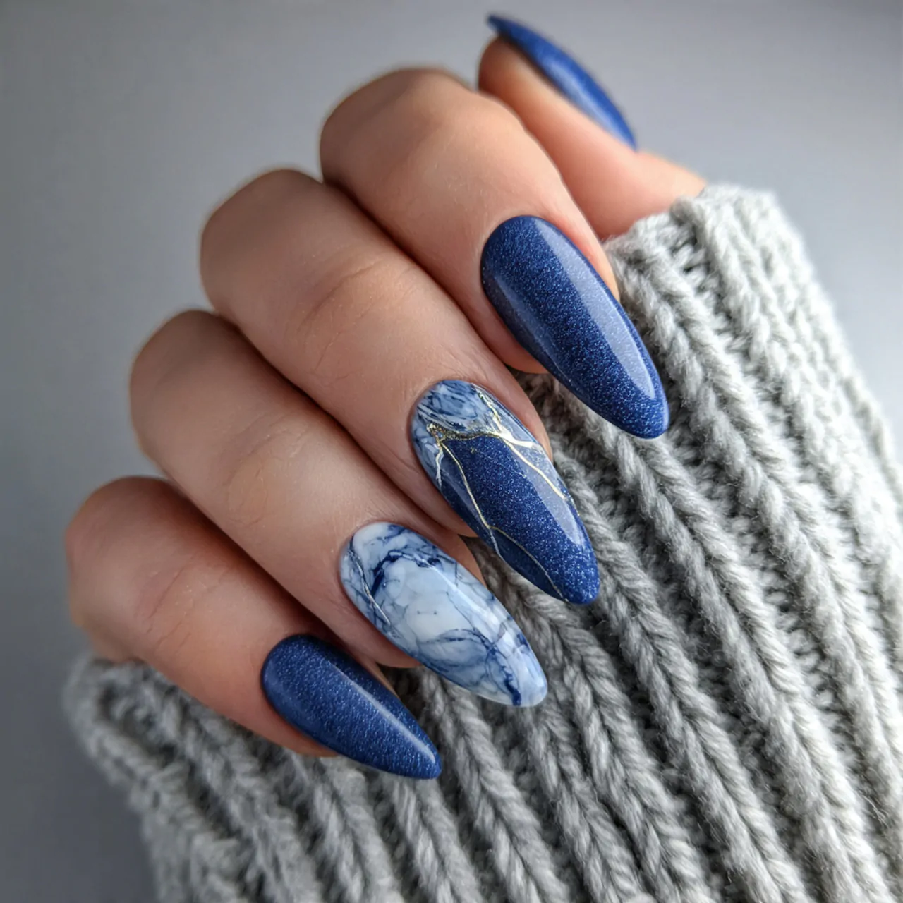 blue cat eye nails with marble accent nails