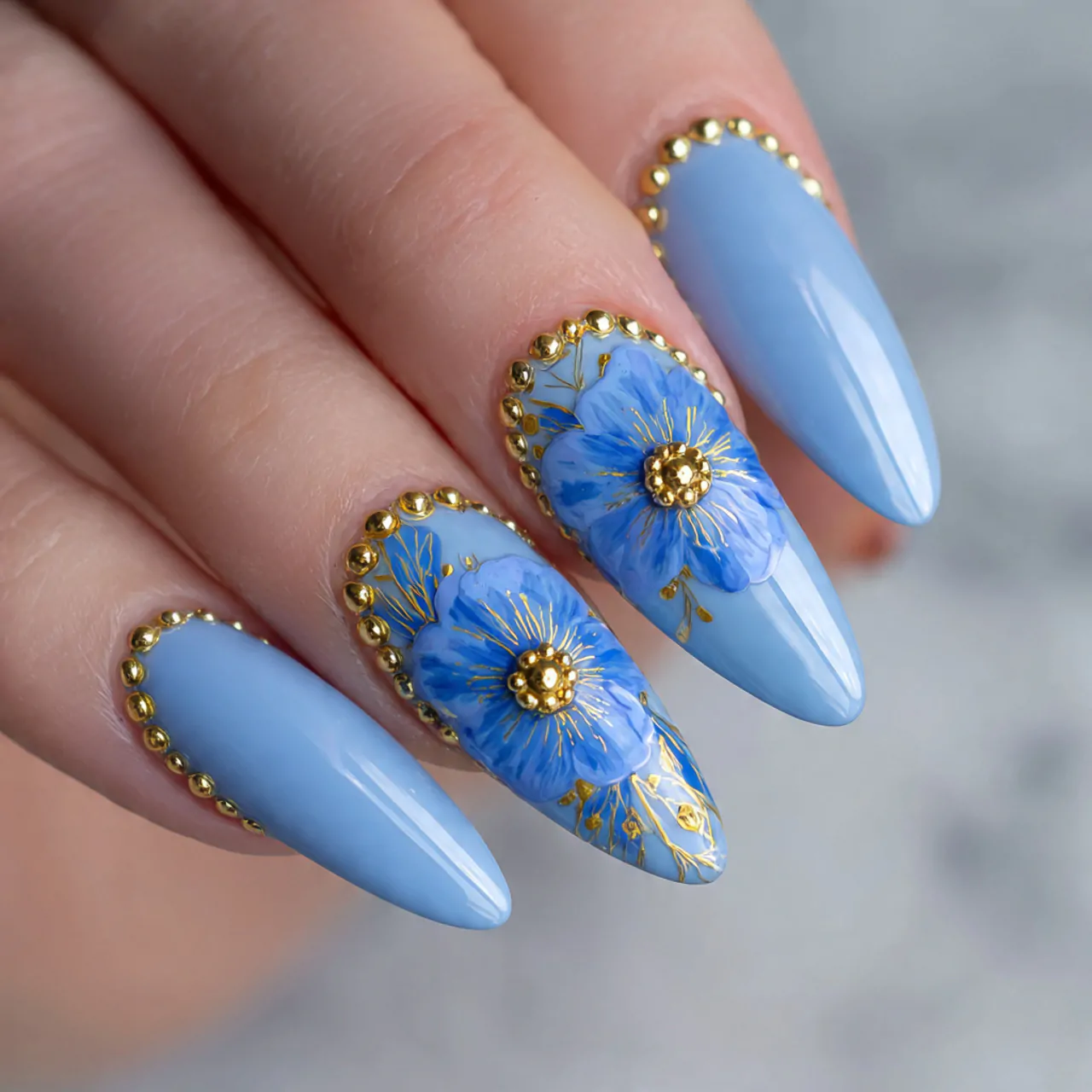 cornflower blue floral nails with gold bead center