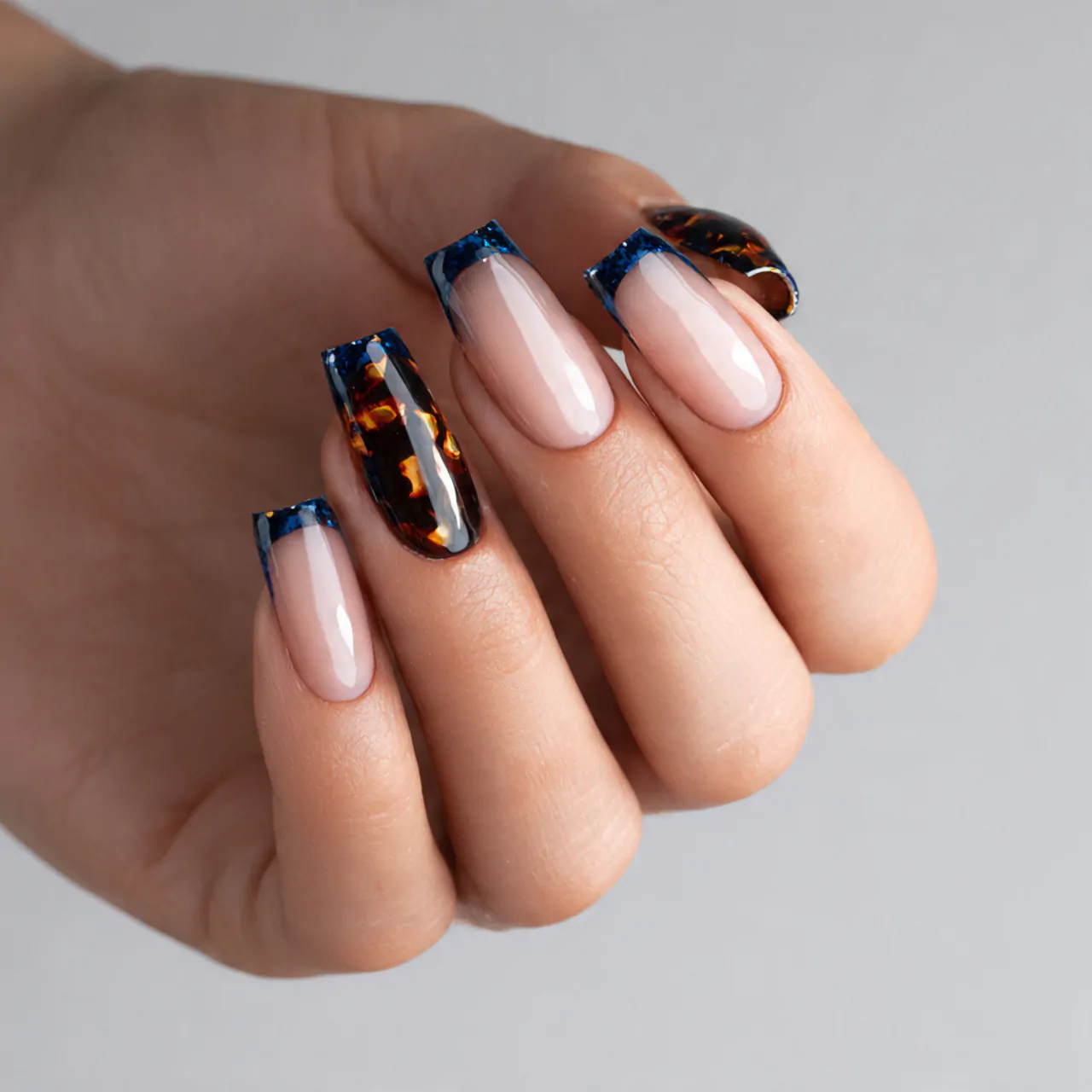 Blue and Brown Nails: 15 Stylish Color Combos That Feel Modern, Chic, and Wearable 5 tortoiseshell and blue french nails